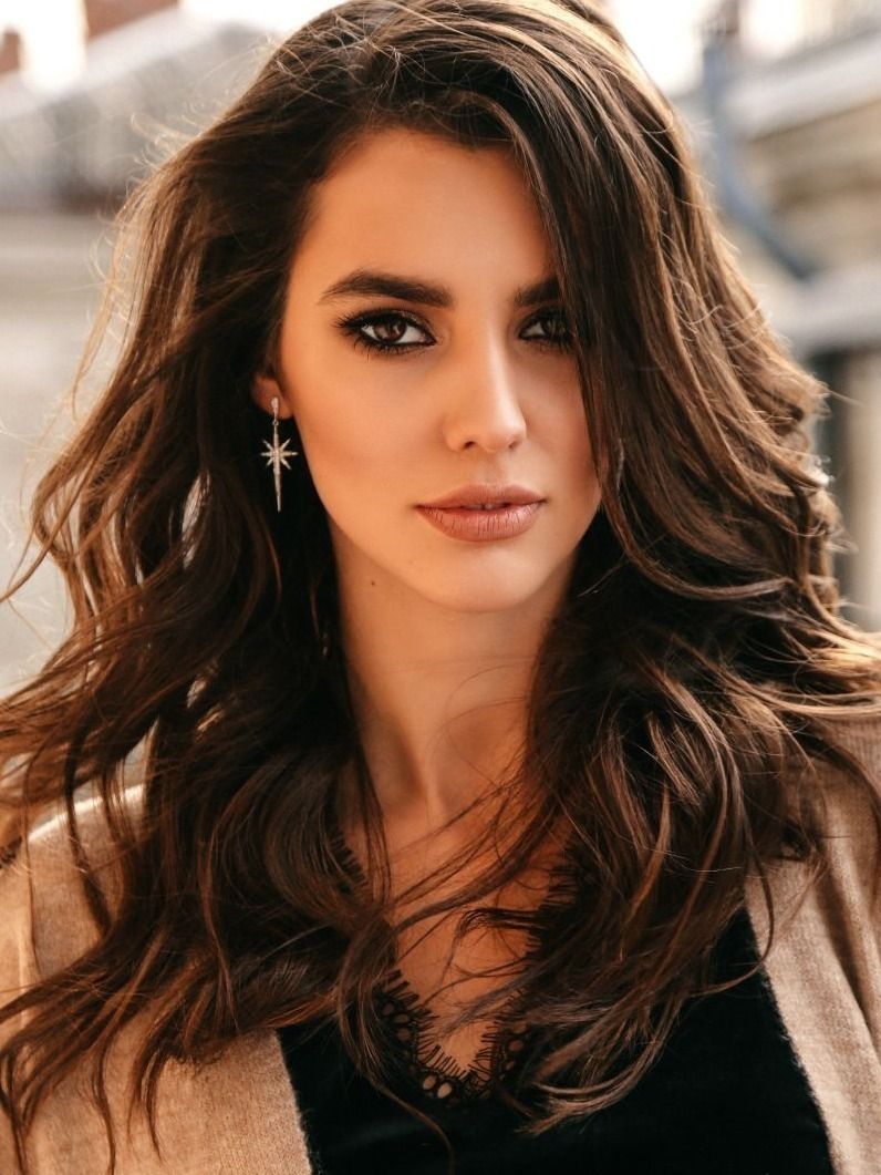 Close-up of a woman with long, blonde hair.